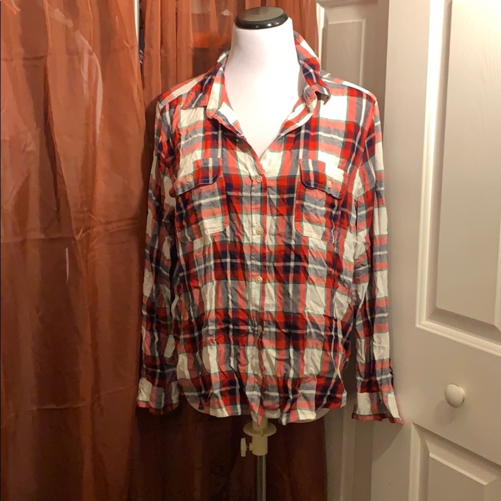 Red and white plaid top. Long sleeves.